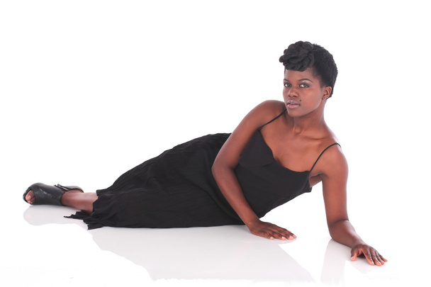 Female laying down in a black dress - Photo, Image