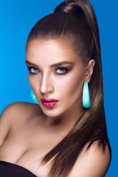 Beautiful woman with evening make-up, bright accessories and long straight hair . Smoky eyes. Fashion photo. - Fotografie, Obrázek