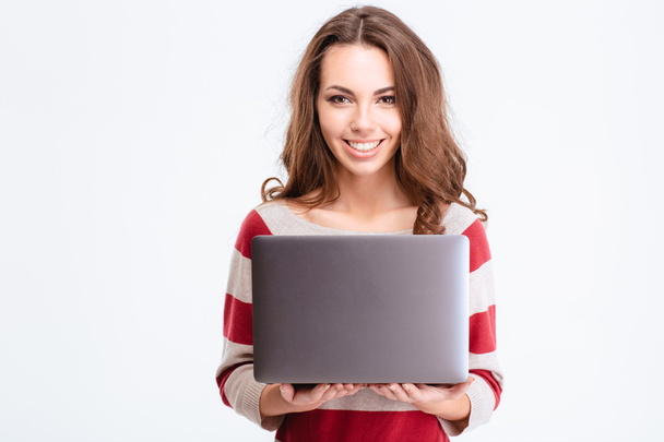 Cheerful woman using laptop computer - Foto, afbeelding