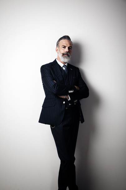 Portrait of handsome middle aged man wearing trendy suit. Vertical - Fotó, kép