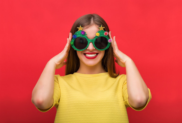 Woman with Christmas party glasses - Photo, Image