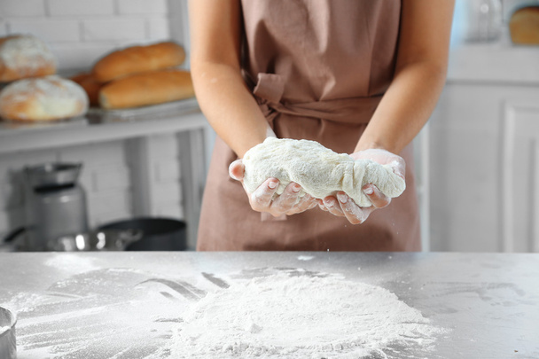 Making dough by female hands  - Фото, изображение