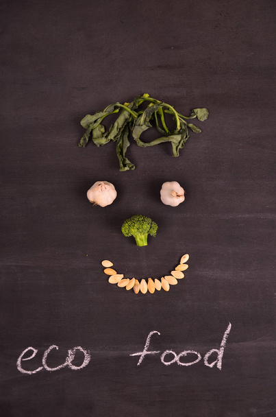 funny face from vegetables on black ground - Foto, Imagem