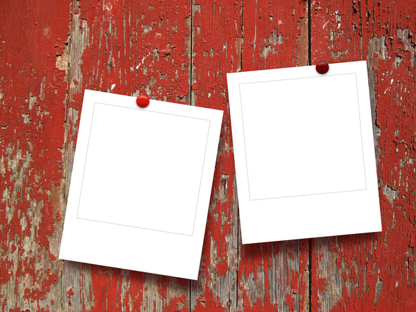 Two blank square instant photo frames with pins on red wooden boards - Photo, image