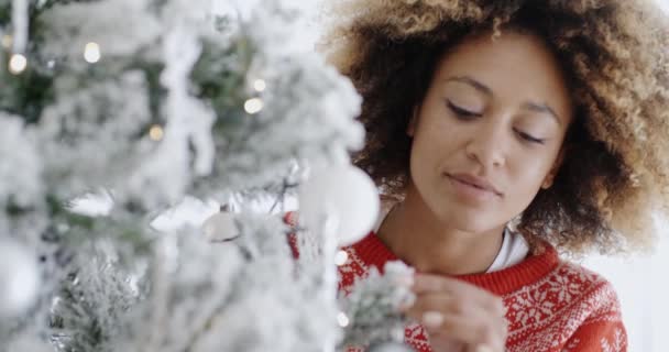 woman decorating Christmas tree - Footage, Video