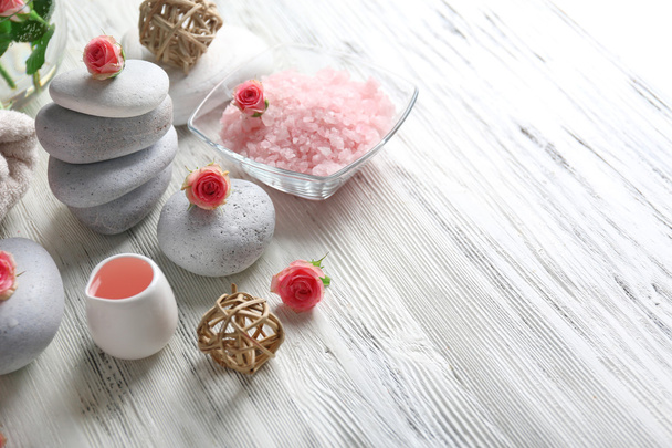 Composition of flowers, salt and stones - 写真・画像