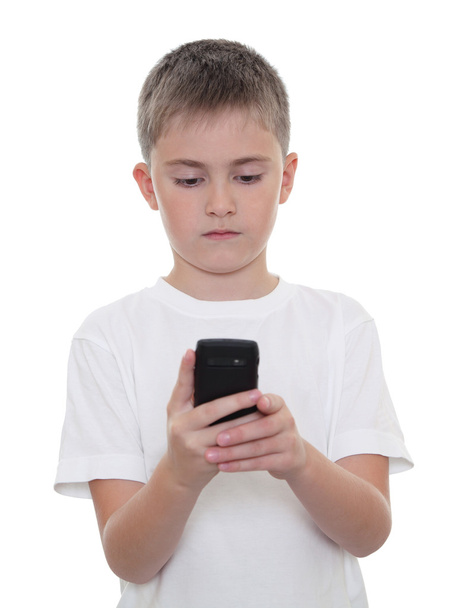 A boy with a mobile phone - Фото, изображение
