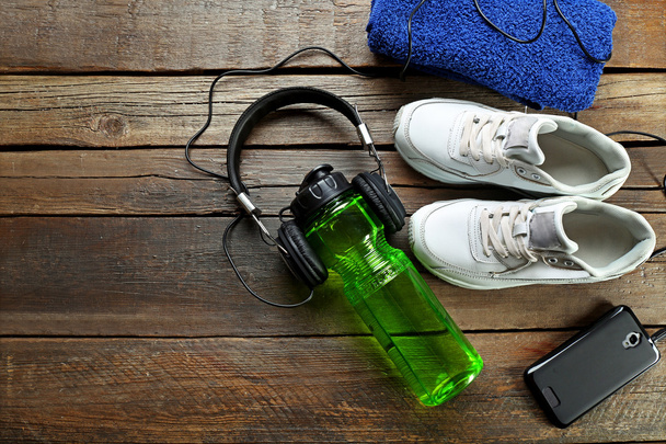Headphones and sport equipment - Foto, Imagen