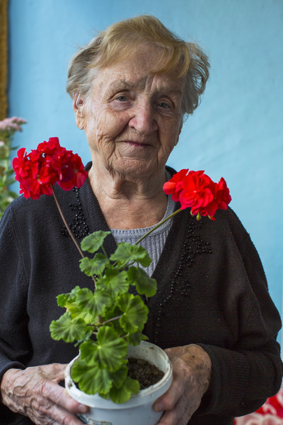 woman with homemade flowers - Photo, Image