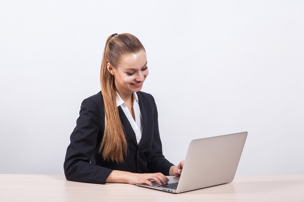 modern young business woman in a business suit on a white backgr - Φωτογραφία, εικόνα