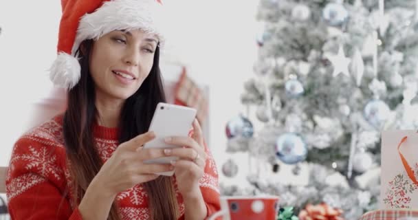 woman checking for Christmas messages - Záběry, video