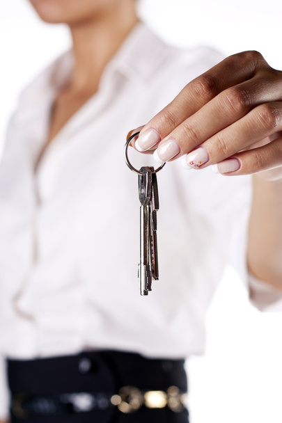 Portrait of Young and beautiful businesswoman holding keys, focu - Foto, immagini