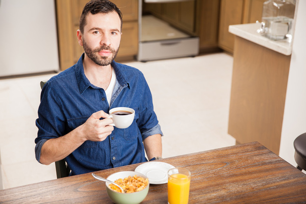 man with a beard having some breakfast - 写真・画像