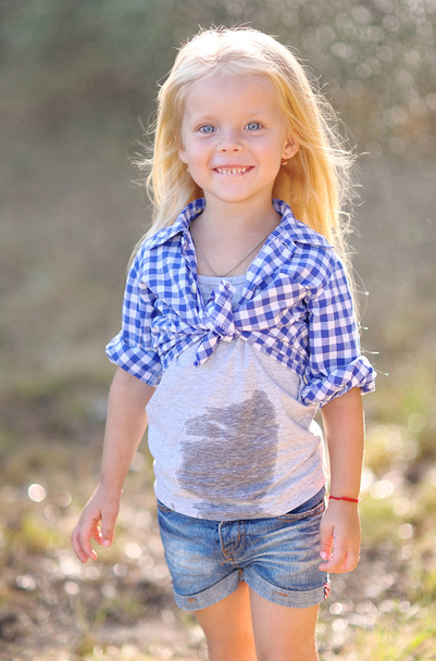 portrait of little girl outdoors in summer - Photo, Image
