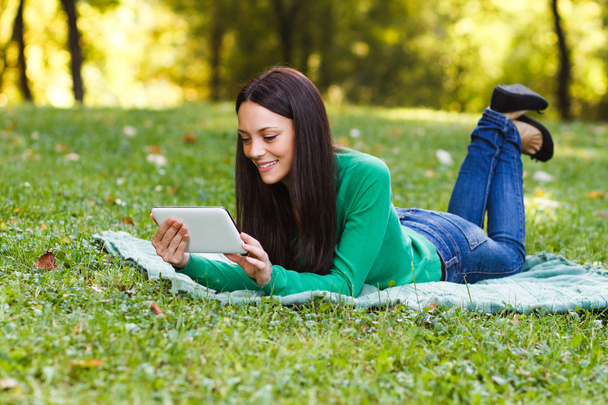 woman in park using tablet - Photo, Image