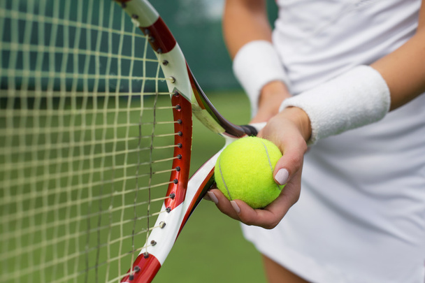 Tennis player holding racket - Photo, Image