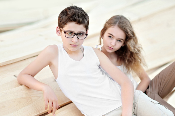Portrait of a boy and girl  in summer - Fotó, kép