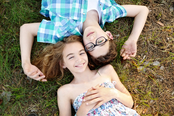 Portrait of a boy and girl  in summer - Photo, Image