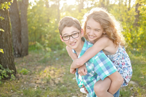 Portrait of a boy and girl  in summer - Photo, image
