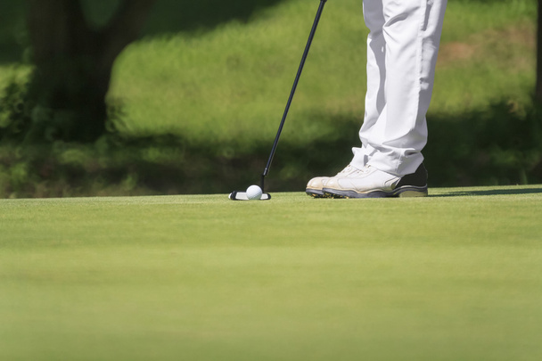Golfer putting, selective focus on golf ball - Photo, Image