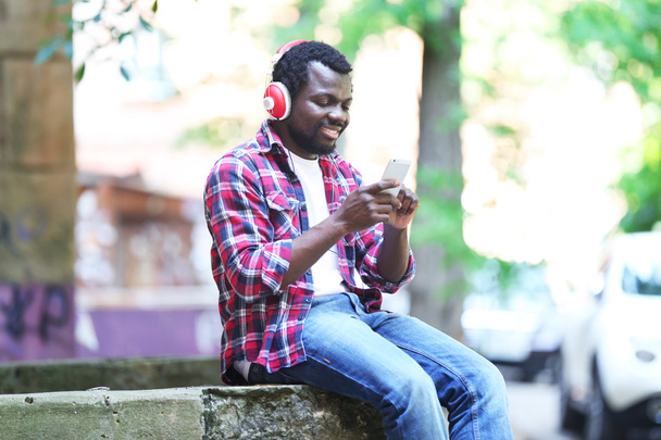 African American man listening music - Фото, зображення