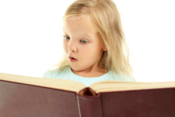 Beautiful little girl with book - Фото, изображение