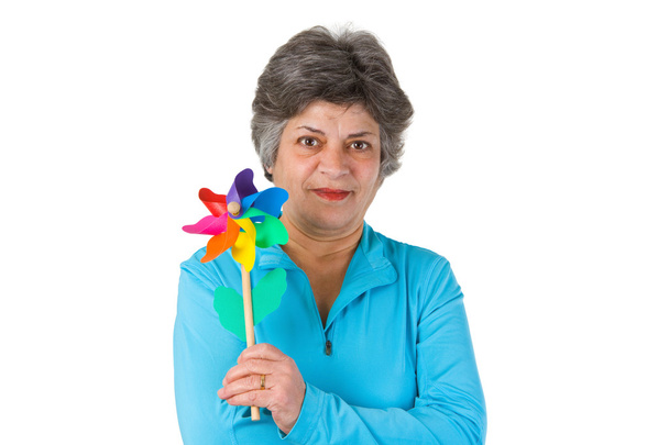 Female senior holding windmill - Foto, afbeelding