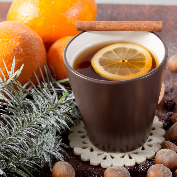 Christmas decoration and mug of tea - Фото, изображение