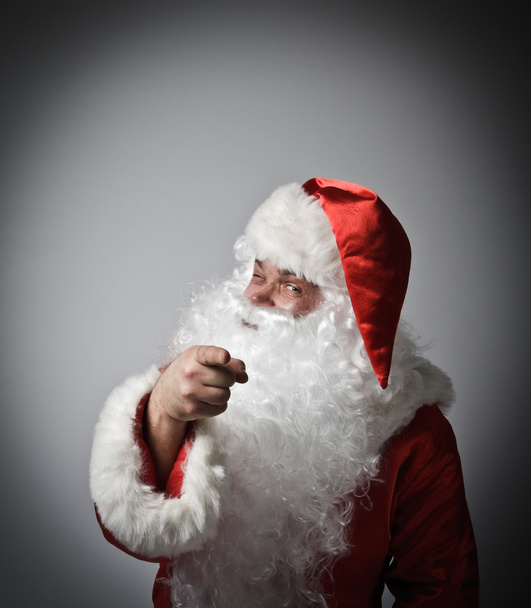 Santa Claus is pointing at somebody. - Foto, Imagen