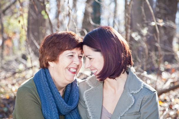 Portrait of Laughing Adult Mother and Daughter - Photo, Image