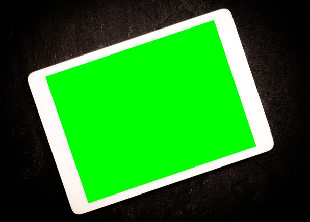 緑の画面のタブレットは - 写真・画像