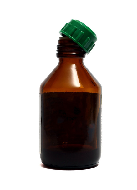 a small brown bottle for medicines on a white background - Fotó, kép