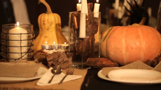 Candle and pumpkins on a table - Footage, Video