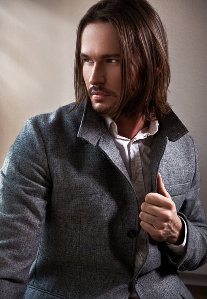 Handsome man with long brown hair - Foto, immagini