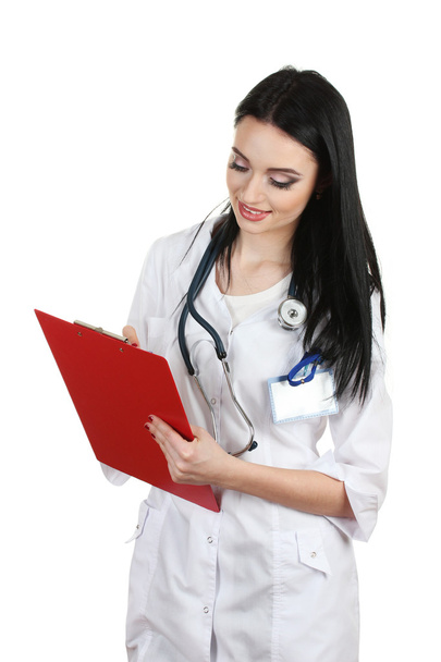 Young beautiful doctor handing folder and write - Фото, изображение