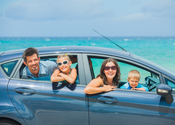 A family of four driving in a car - Foto, imagen