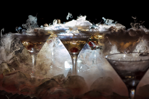 drink in glasses with the effect of dry ice - Photo, Image