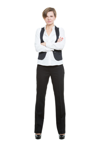 Portrait in full growth. Businesswoman legs wide apart. isolated white background. closed pose, arms crossed - Valokuva, kuva
