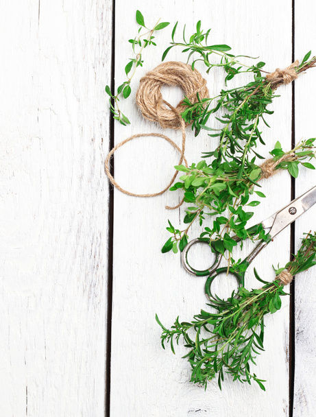 Mix of herbs on a wooden table, savory, thyme - Foto, Imagen