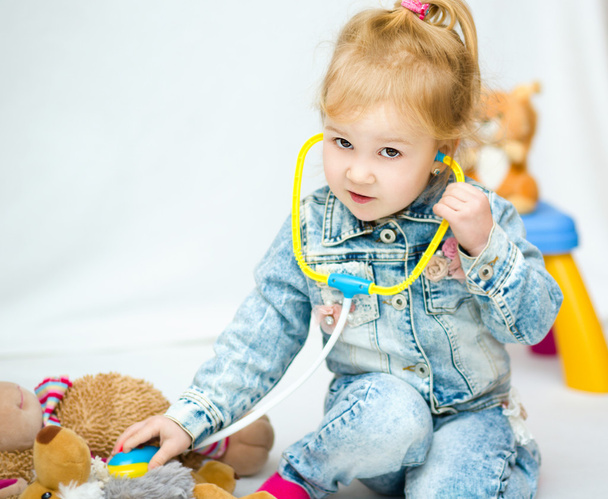 Cute little girl is playing doctor - Photo, Image