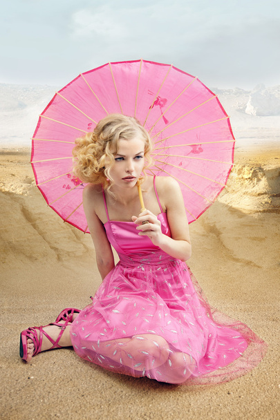 Beautiful girl with sun umbrella - Fotó, kép