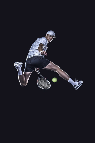 テニス プレーヤーの分離は難しいボールに手を伸ばす - 写真・画像