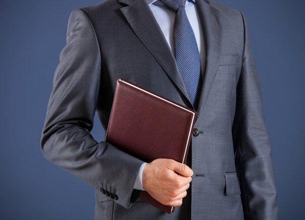 Businessman holding a book - Photo, Image