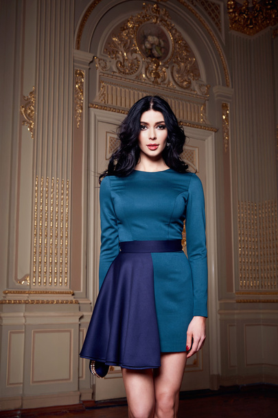 Beautiful sexy woman in elegant dress fashionable autumn Collection of spring long brunette hair makeup tanned slim body figure accessories interior luxury castle gold monogram baroque palace of Queen - Zdjęcie, obraz