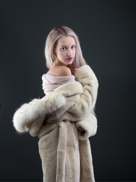 Young Woman Fashion Model dressed in white fur coat - Фото, изображение