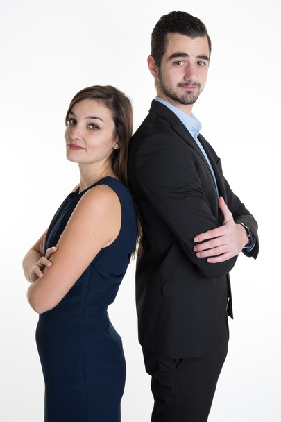 Sucessful business team with arms crossed leaning back to back - Photo, Image
