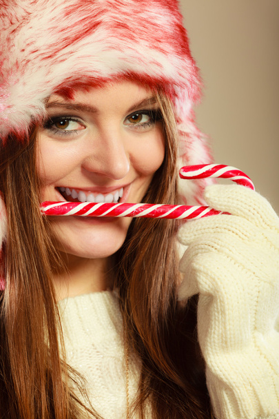 woman holding sweet candy cane - Foto, immagini