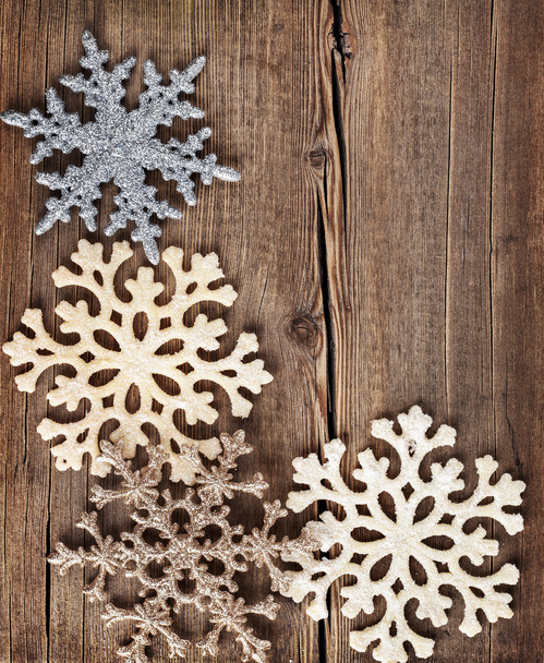 Christmas background. Snowflakes border on grunge wooden board.  - 写真・画像