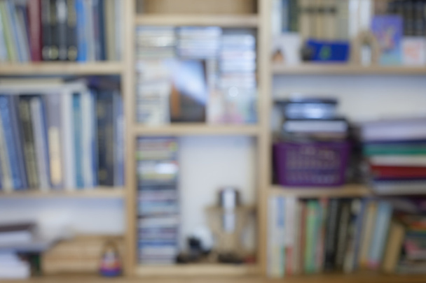 Blurred image of bookshelves with books - Photo, Image