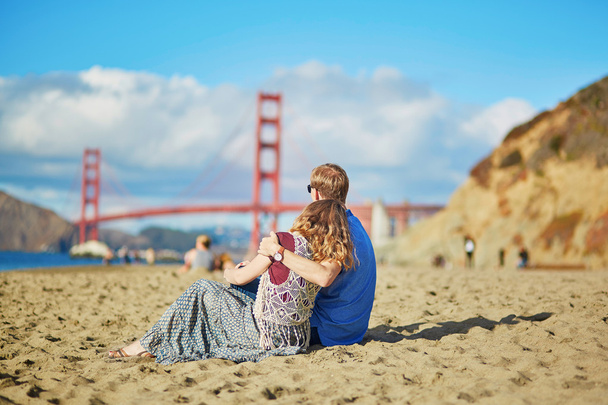 Romantic loving couple having a date on Baker beach in San Francisco - Zdjęcie, obraz